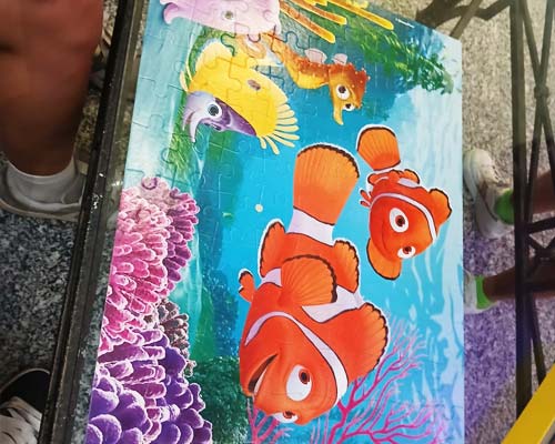 Children play with puzzle