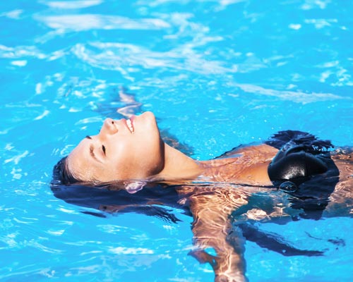Girl relaxes in the pool