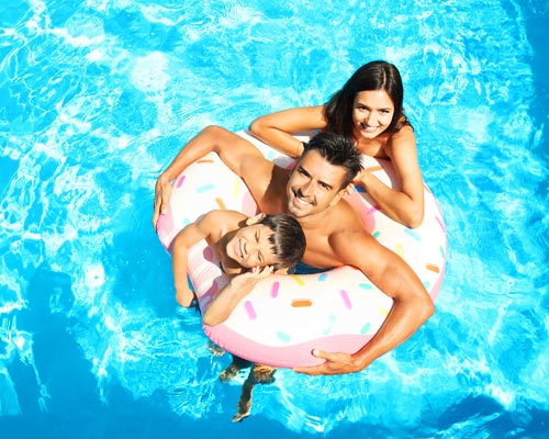 Family in the swimming pool